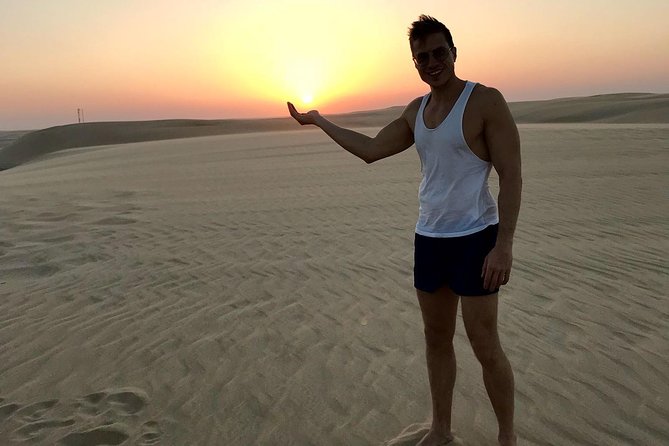 4 Hour Desert Safari, Camel Ride & Inland Sea Beach - Sandboarding for a simple desert thrill