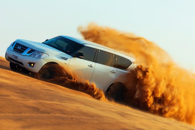 Desert Safari with Camel Ride, Sand Boarding & Inland Sea Tour in Doha - Sandboarding from a High Dune