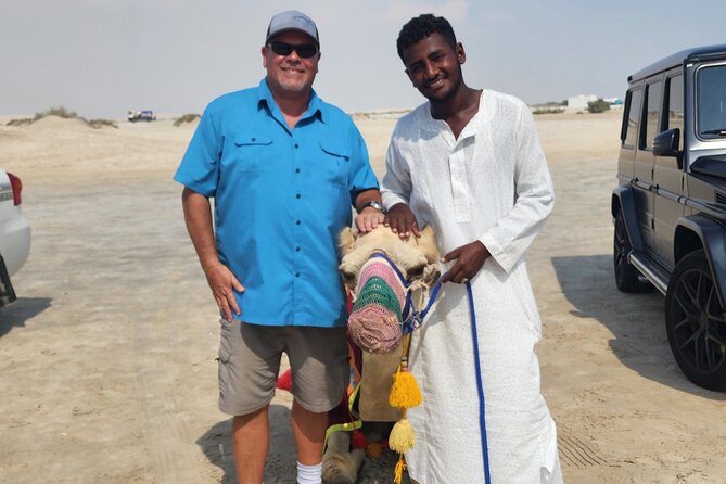 Desert Safari with Sandboarding and Inland Sea Private Tour - Sandboarding on Qatar’s golden dunes