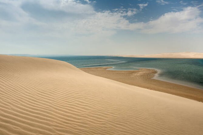 Doha Desert Quad Bike adventure with group, and Sand dune Driving - Sandboarding adds a simple, low-cost challenge