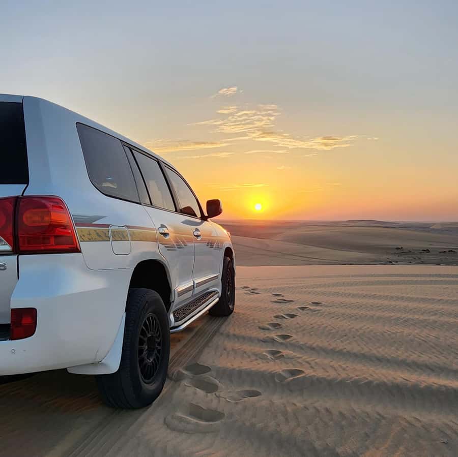 Doha: Desert Safari, Adventure, Sandboarding and Camel Ride - Two hours of dune bashing in a Land Cruiser