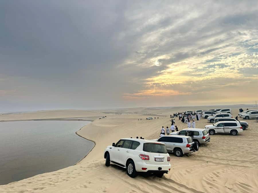 Doha Desert Safari, Camel Ride, Sandboarding & Inland Sea - Sandboarding down the dunes