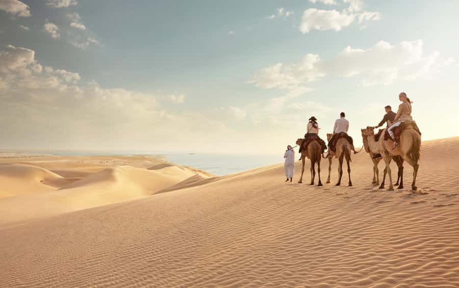 Doha: Desert Safari with Dune Bashing and Inland Sea - Mesaieed’s short photo stop and camel experience