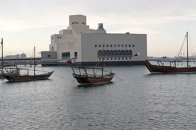 Doha from Land & Sea: City Tour & Traditional Dhow Boat Ride - Boarding the wooden dhow for 30 minutes