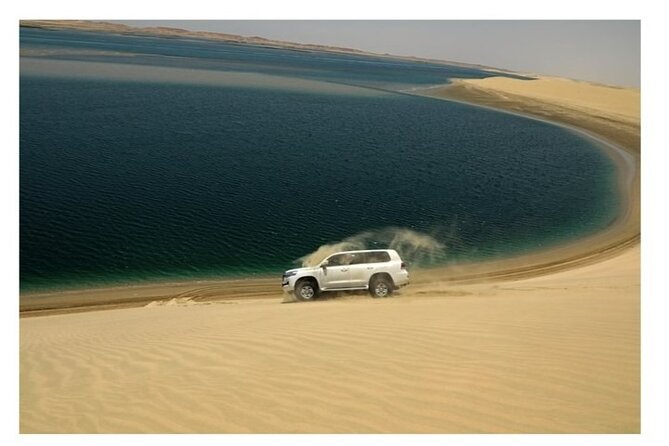 Doha Half Day Desert Safari Dune Bashing CamelRide & Sandboarding - Sunset, inland sea, and photo time