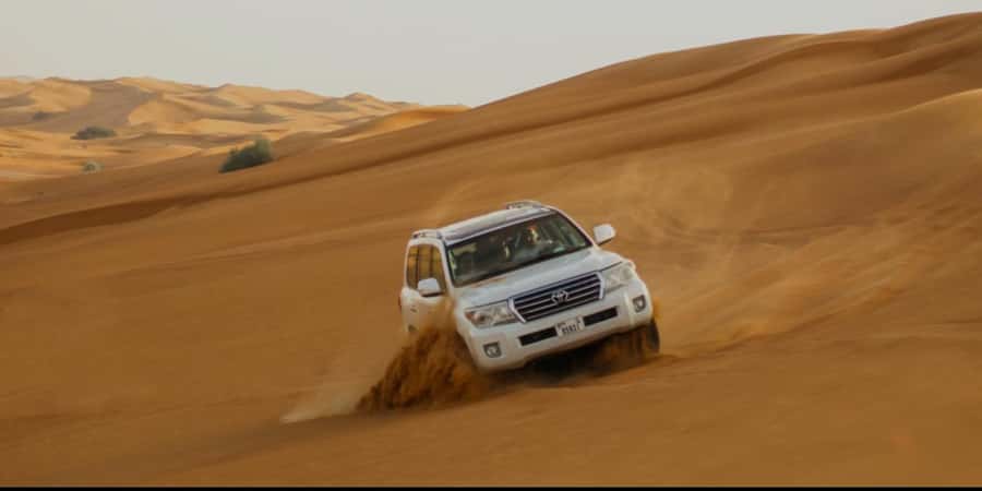 Doha: Half Day Desert Safari With Camel Ride & Sand Boarding - Dune bashing is the adrenaline portion