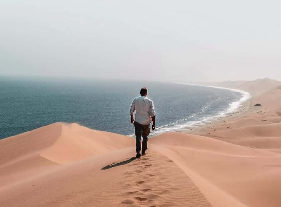 Doha: Inland Sea Desert Safari with Sunset & Sunrise Views - Leaving Doha in a 4x4 Land Cruiser