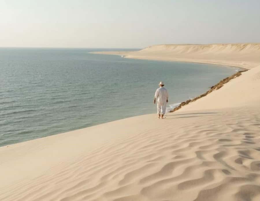 Doha: InlandSea Tour,Camel,Sand Boarding With All Activities - Dune bashing across Qatar’s golden sand