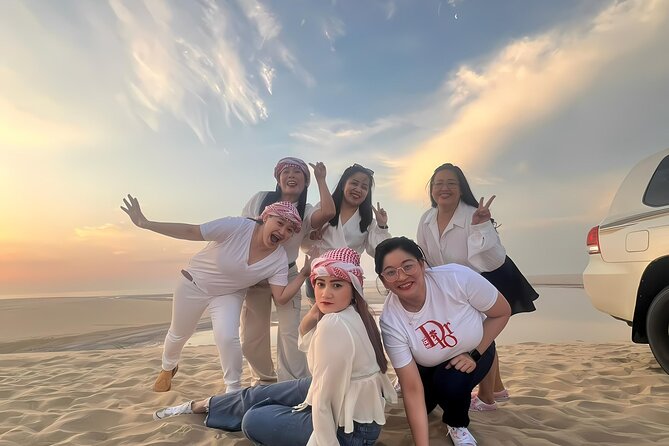 Doha: Luxury Desert Safari, Quad Bike & Sandboarding - Sandboarding from the high dunes