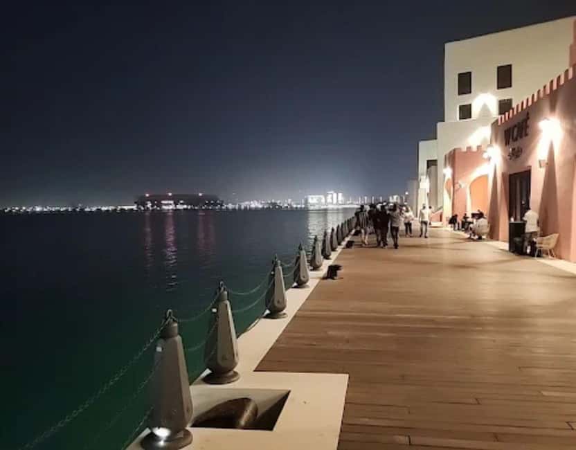 Doha: Mina District's Colorful Streets & Coastal Vibes Tour - Pink, blue, and yellow streets made for photographs