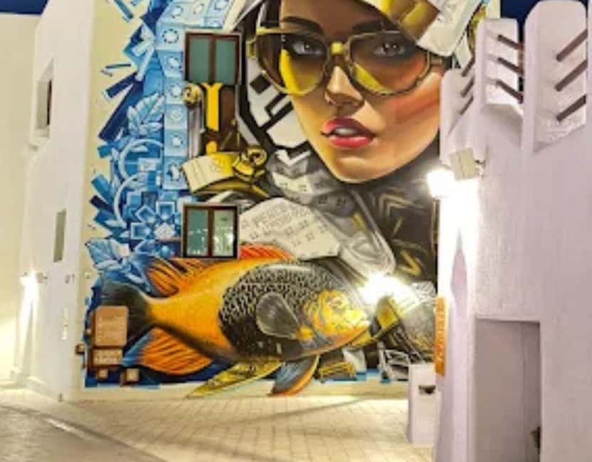 Doha: Mina District's Colorful Streets & Coastal Vibes Tour - Boutique shops and Doha’s modern lifestyle scene