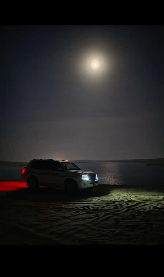 Doha: Night DesertSafari DuneBashing Sandboarding CamelRide - Leaving Doha for the moonlit desert
