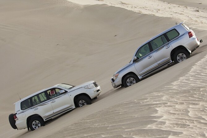 Doha Private Half-Day Guided Desert Safari Tour - Sandboarding on the dunes