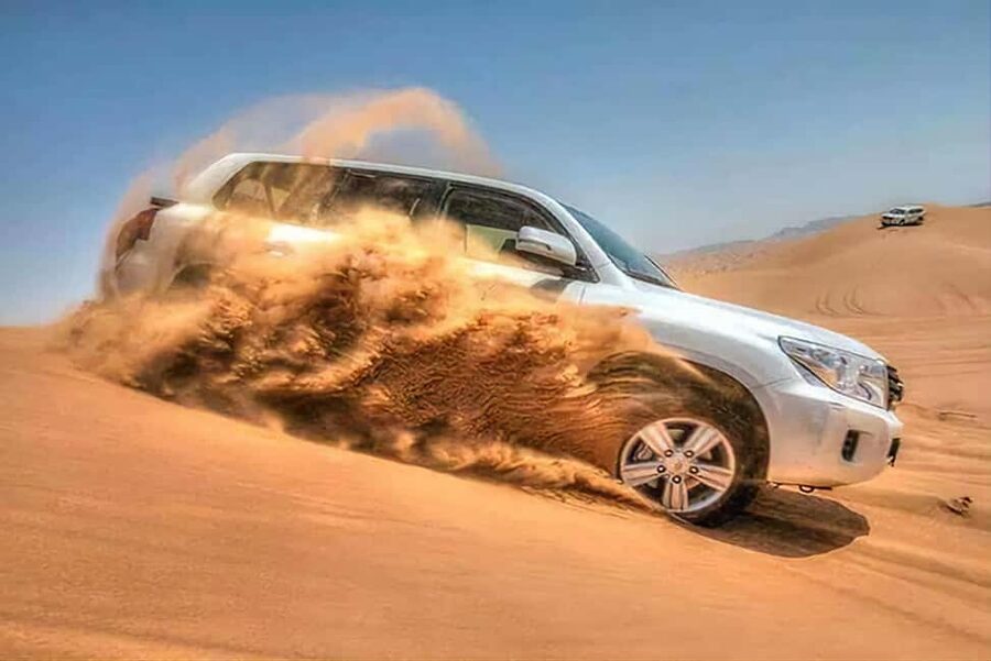 Doha Qatar : sealine adventure Camel Ride sandboard Sunset - Dune bashing across Qatar’s sand