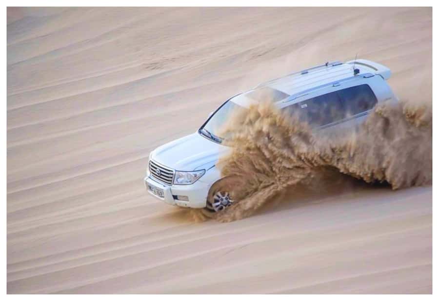 Dune Bashing, Sandboarding, Camel Ride & Optional ATV Ride - The camel stop near Mesaieed