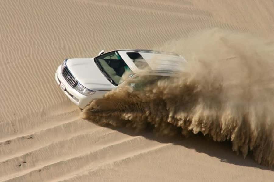 Dune Bashing, Sandboarding, Camel Ride & Optional ATV Ride - Optional ATV riding on a desert track
