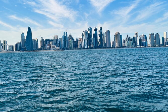 Exclusive Doha Private Dhow Cruise & Corniche Walk With Sunset - Sunset atmosphere, music, and photo timing