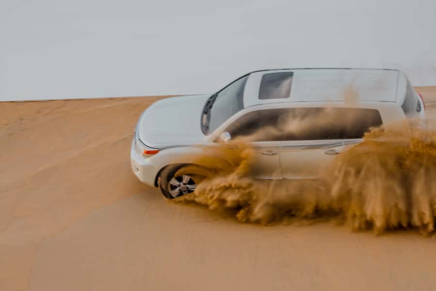 Explore desert Qatar: Off-Road Adventures, dune bashing Tour - Tea, tire deflation, and the camel stop