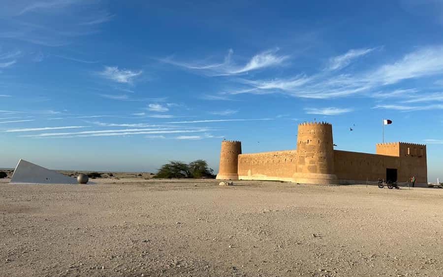 Explore North Qatar with history and archaeological sites. - Al Bayt Stadium and the road north