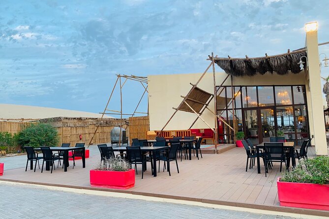 Full-day Qatar desert safari: dune bashing, sandboarding, camels - A full day from Doha to Qatar’s southern desert