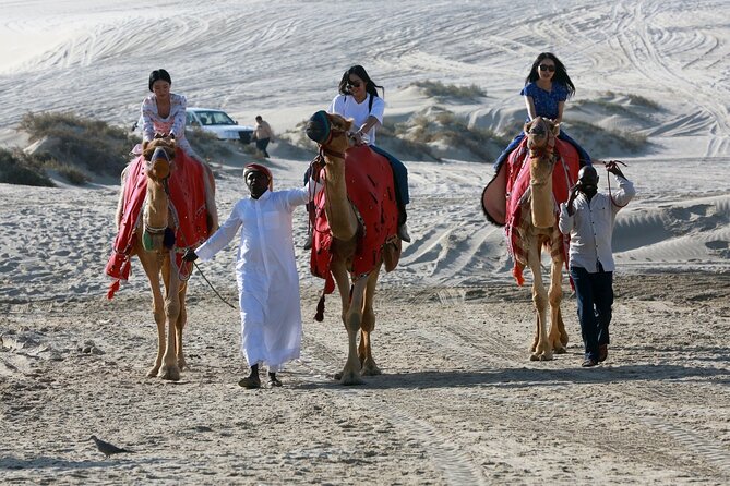 Full-day Qatar desert safari: dune bashing, sandboarding, camels - Deflating the tires at Sealine