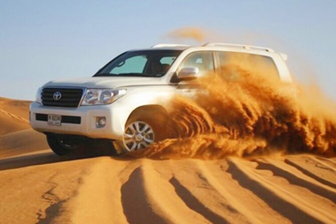 Half Day Desert Safari with Sand Boarding and Camel Ride - Trying the camel ride