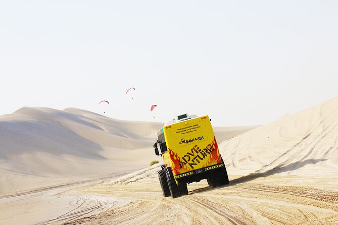 Monster Bus desert adventure: Dune bashing and sandboarding - Sealine Beach and the sand-meets-sea view