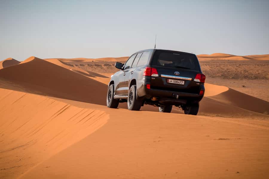 Qatar Desert Safari, Quad bike, Camel Ride and Sandboarding - Dune bashing on the way to the Inland Sea