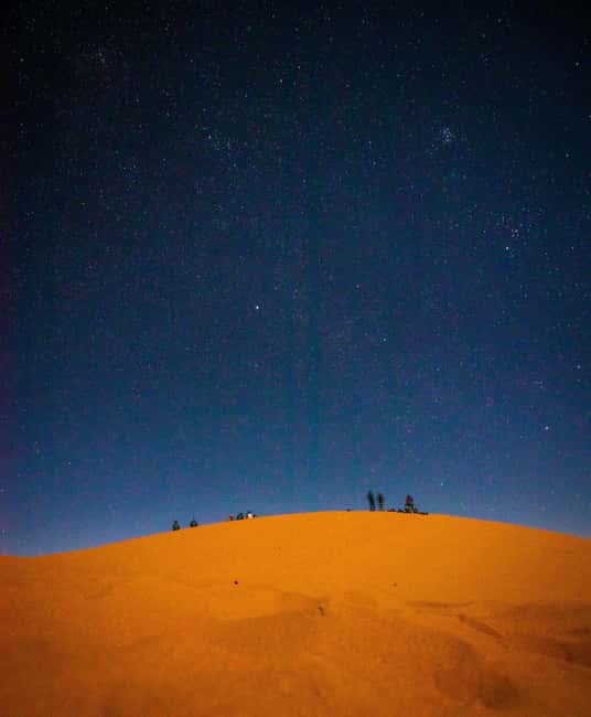 Star Studded Night Desert Safari Doha Qatar - Sandboarding under a dark sky